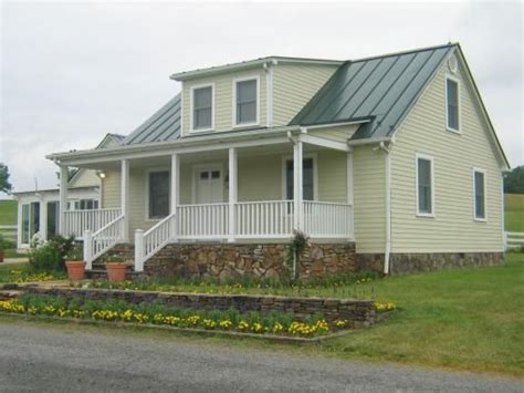 yellow house gray metal roof|yellow house with metal roof.